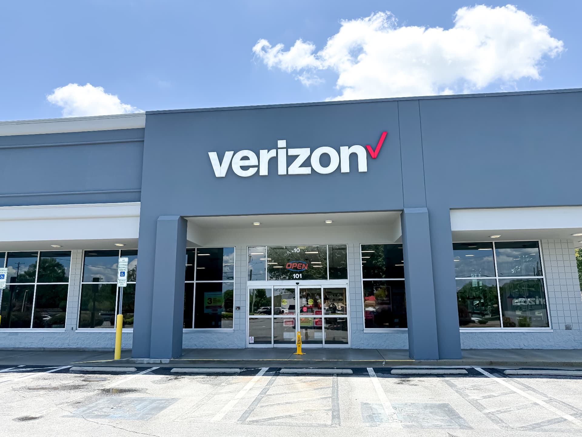 Verizon retail storefront and concrete sidewalk
