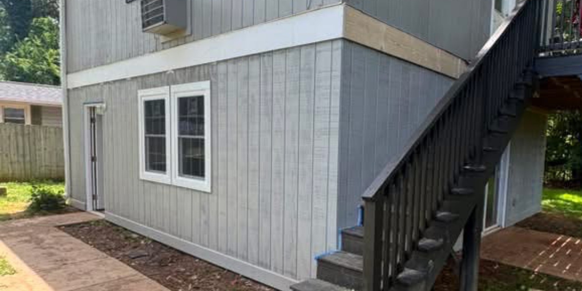 Exterior painting and trim detail on a renovated property