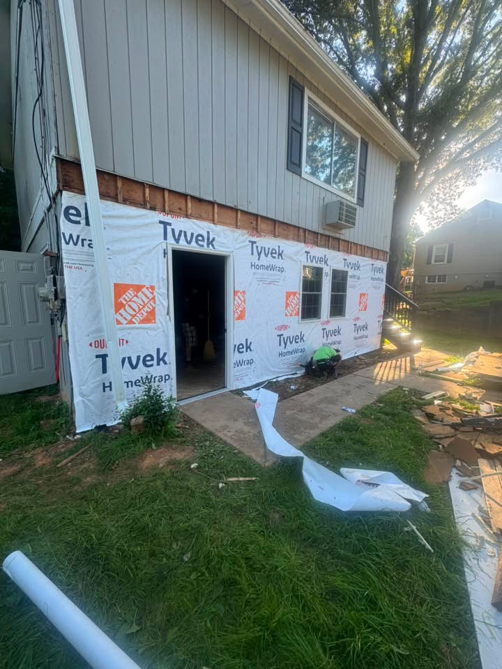 New wood siding and window trim installed on a remodel