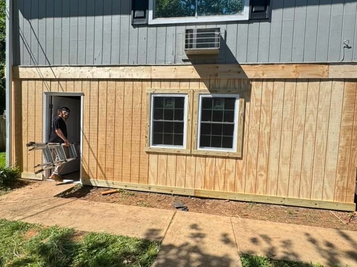 ProFlow crew installing new siding and windows during a remodel